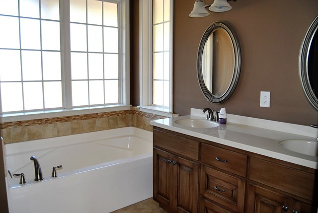1399 Edge Road Forsyth, GA 31029 - Photo 21 of 31 a bathroom with a tub sink and mirror