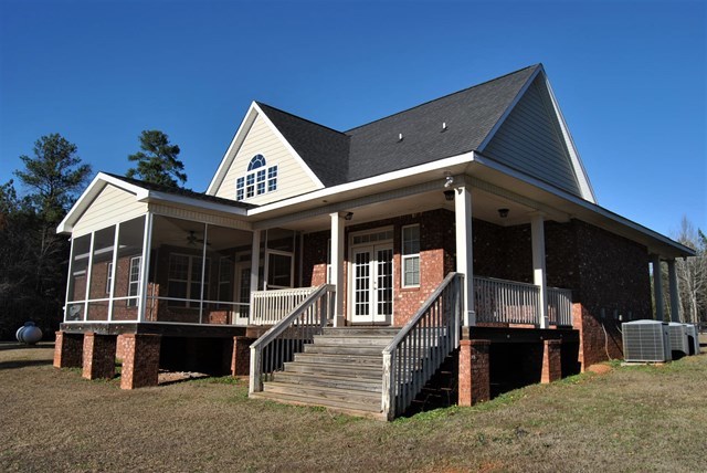 1399 Edge Road Forsyth, GA 31029 - Photo 28 of 31 a view of house with deck area and wooden floor