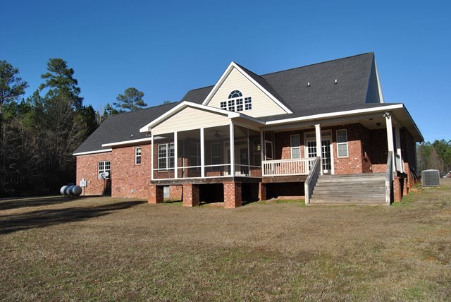 1399 Edge Road Forsyth, GA 31029 - Photo 29 of 31 a house with trees in the background
