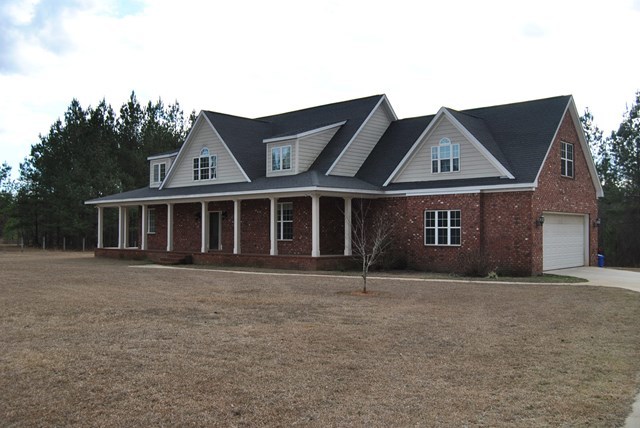 1399 Edge Road Forsyth, GA 31029 - Photo 4 of 31 a front view of a house with a garden