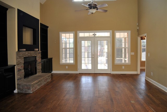 1399 Edge Road Forsyth, GA 31029 - Photo 8 of 31 a view of an empty room with a window and wooden floor