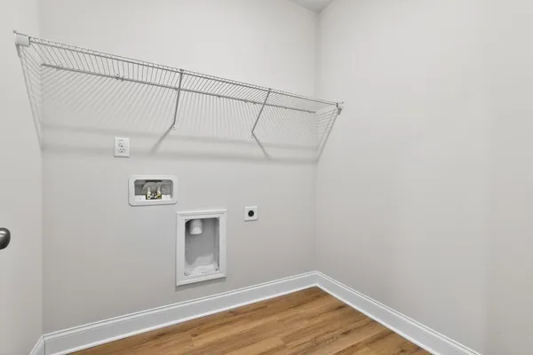 a view of a small space with wooden floor