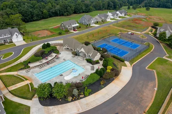 an aerial view of a house with a ocean view