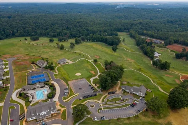 a view of a swimming pool with a yard