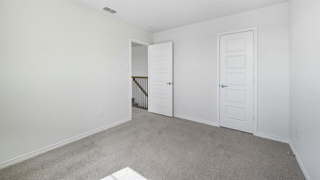 1203 Rusted Rail Drive Princeton, TX 75407 - Photo 15 of 37 Unfurnished bedroom featuring carpet flooring and baseboards