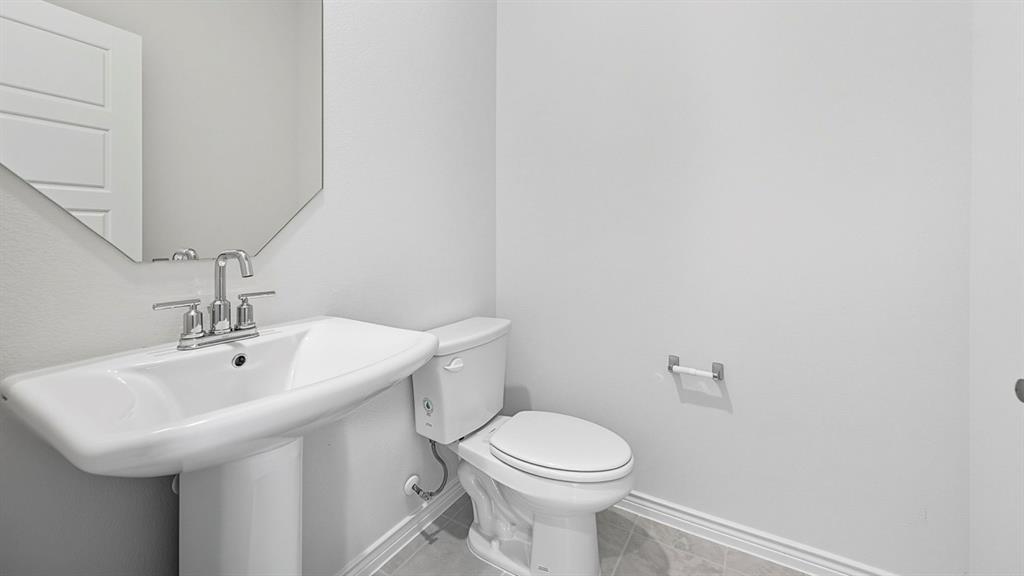1203 Rusted Rail Drive Princeton, TX 75407 - Photo 7 of 37 Half bath with baseboards