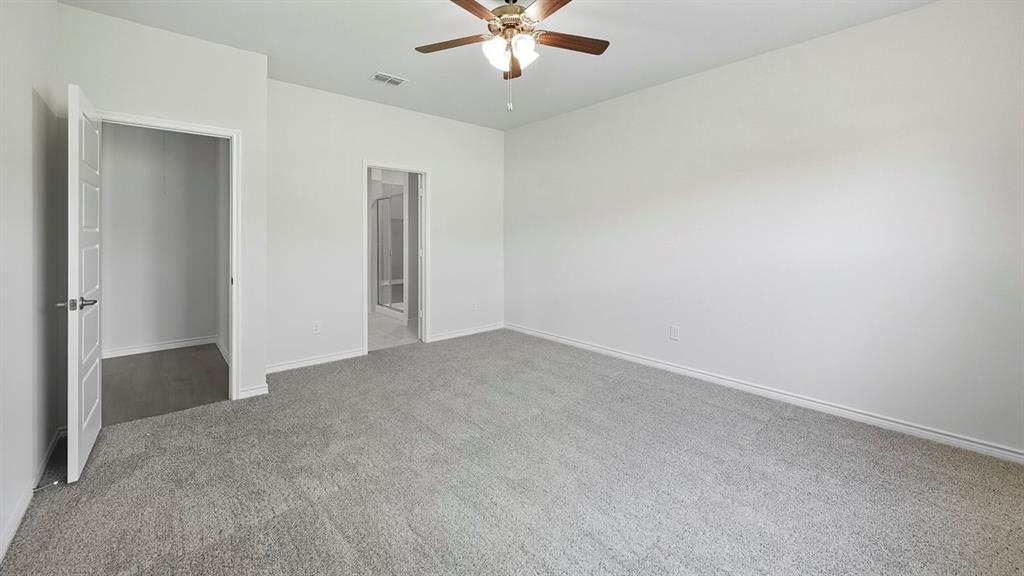 1203 Rusted Rail Drive Princeton, TX 75407 - Photo 9 of 37 Unfurnished bedroom with carpet flooring and ceiling fan