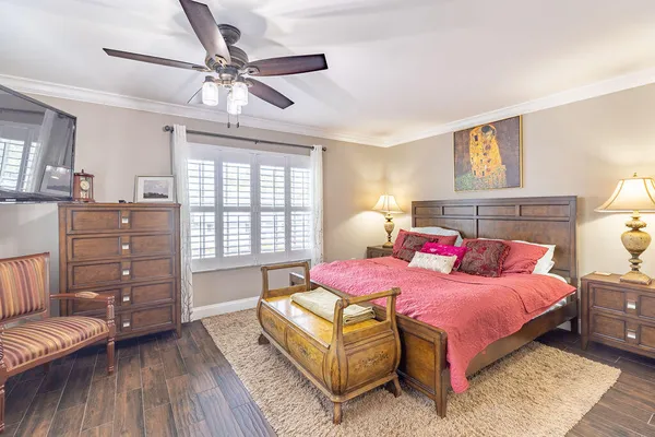 a bedroom with a bed and a couch