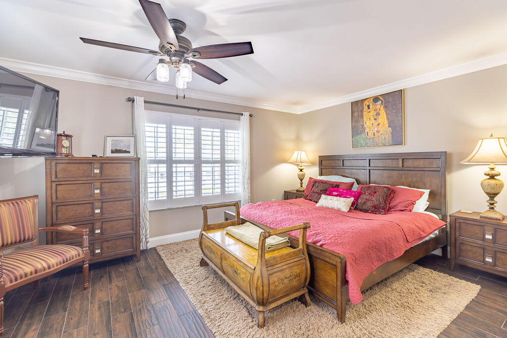 1038 Jeffery Street Boca Raton, FL 33487 - Photo 19 of 47 a bedroom with a bed and a couch