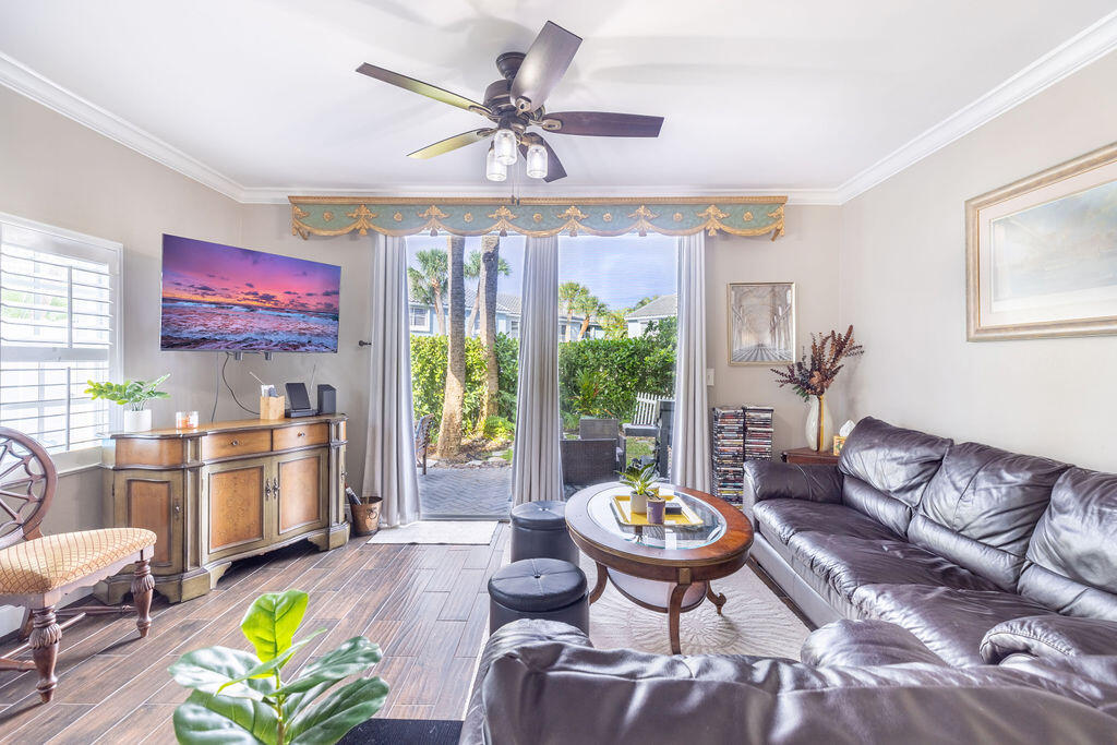 1038 Jeffery Street Boca Raton, FL 33487 - Photo 2 of 47 a living room with furniture and a kitchen