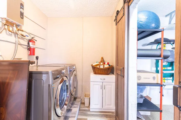 a utility room with dryer and washer