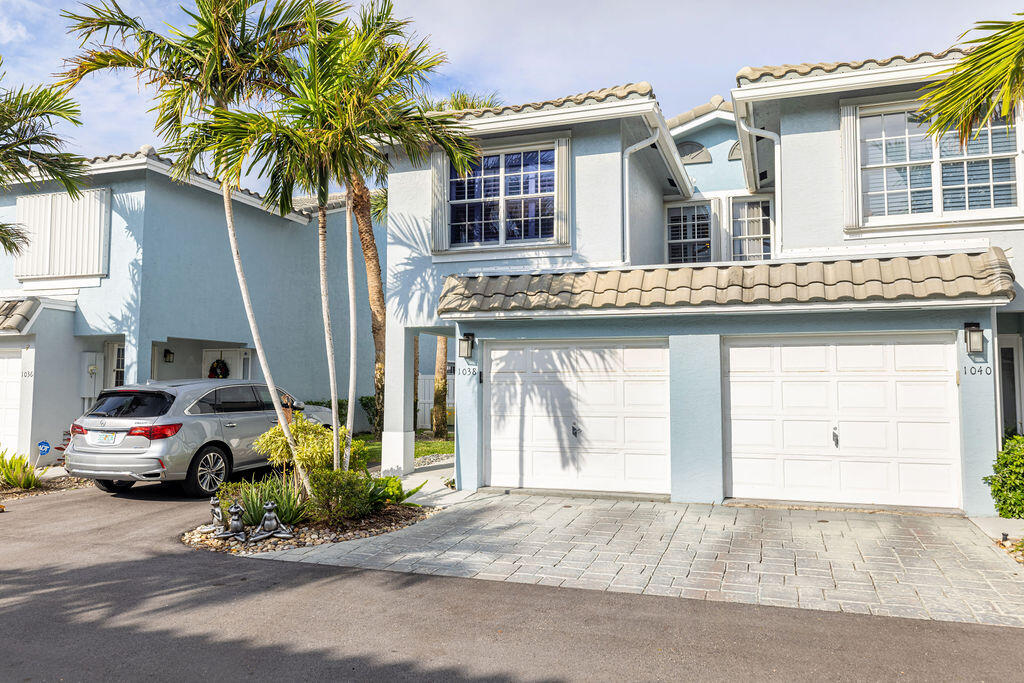 1038 Jeffery Street Boca Raton, FL 33487 - Photo 37 of 47 a car parked in front of a house