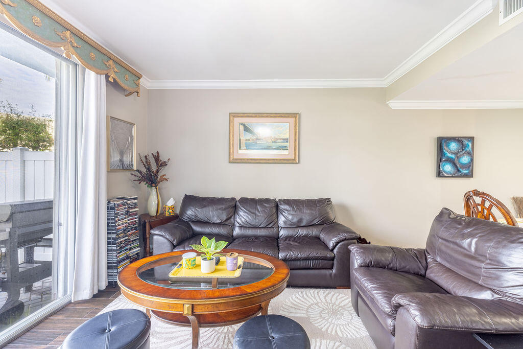 1038 Jeffery Street Boca Raton, FL 33487 - Photo 5 of 47 a living room with furniture and a lamp