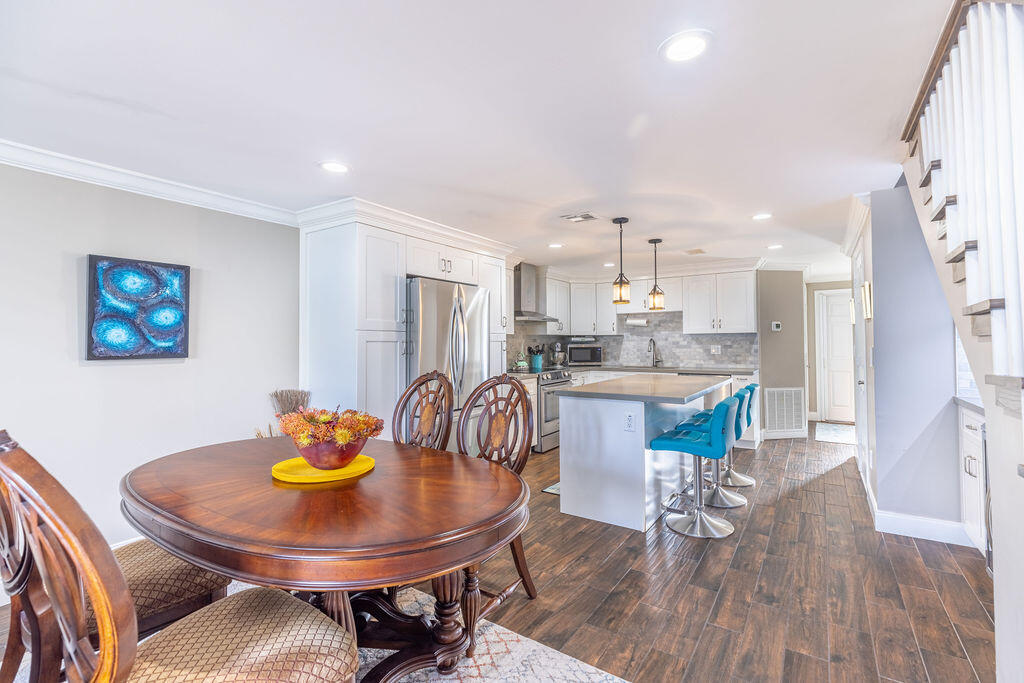 1038 Jeffery Street Boca Raton, FL 33487 - Photo 8 of 47 a kitchen with a table and chairs