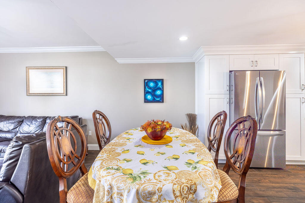 1038 Jeffery Street Boca Raton, FL 33487 - Photo 9 of 47 a bedroom with a bed and wooden floor