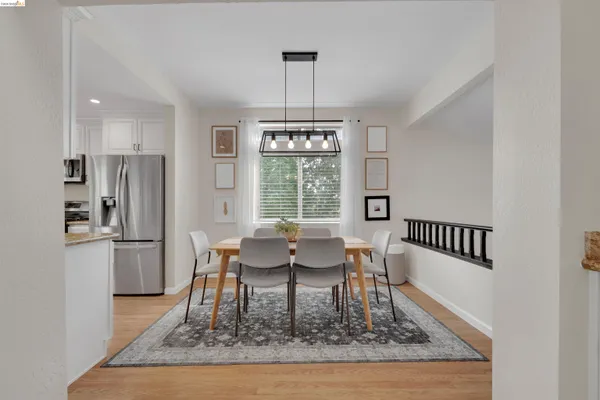 a view of a dining room with furniture window and wooden floor