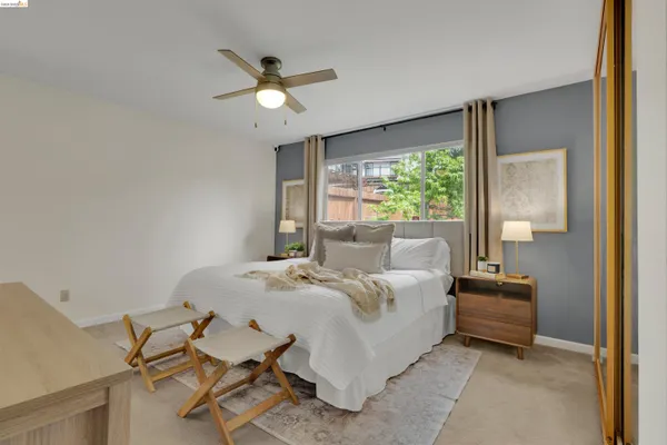 a bed room with a bed and a chandelier