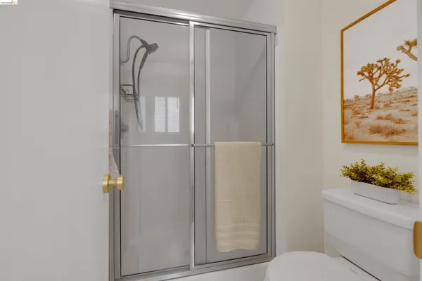 a bathroom with a shower and a toilet