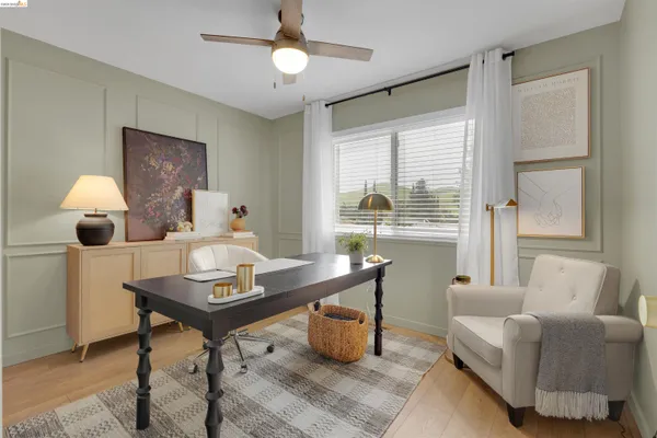 a workspace with furniture and a window