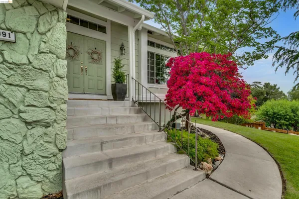 a view of a house with a small garden