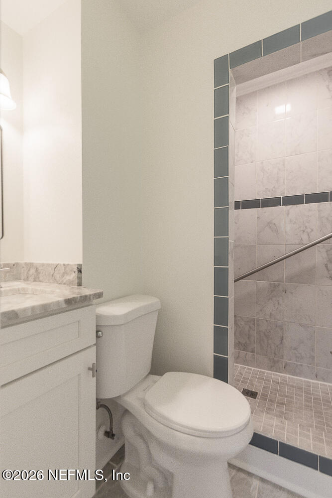 2754 Rainbow Road Jacksonville, FL 32217 - Photo 11 of 25 a bathroom with a toilet a sink and shower
