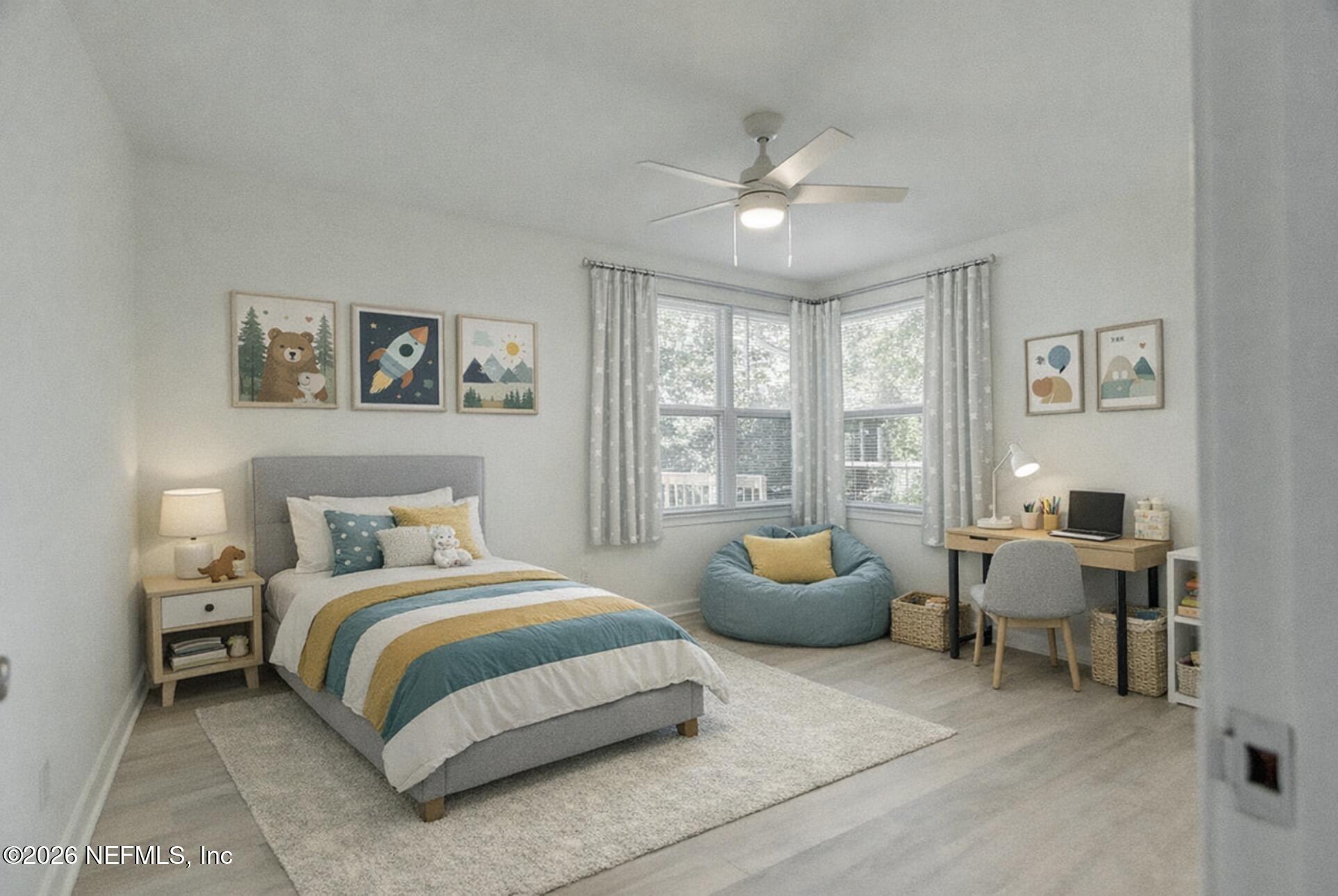 2754 Rainbow Road Jacksonville, FL 32217 - Photo 15 of 25 a bedroom with a bed and a large window