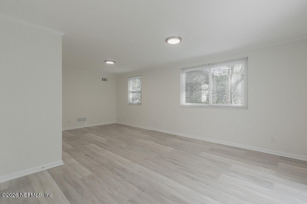 2754 Rainbow Road Jacksonville, FL 32217 - Photo 17 of 25 an empty room with a window