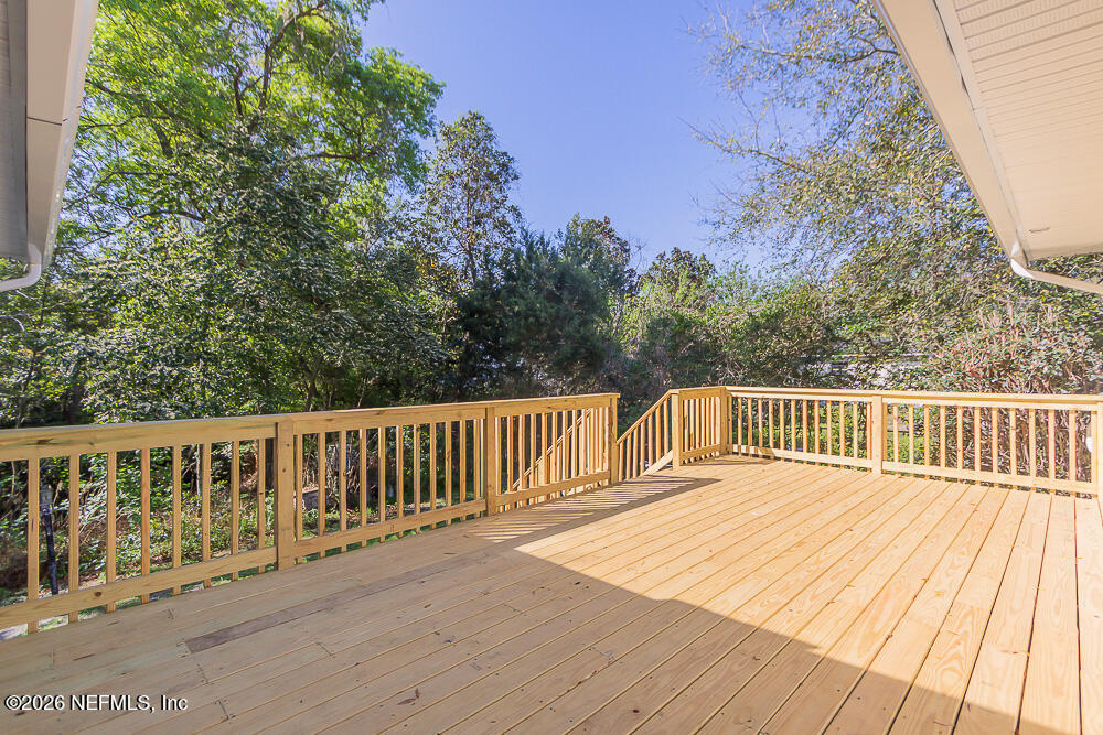 2754 Rainbow Road Jacksonville, FL 32217 - Photo 22 of 25 a balcony with wooden floor and fence