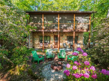 a view of a chairs in a backyard