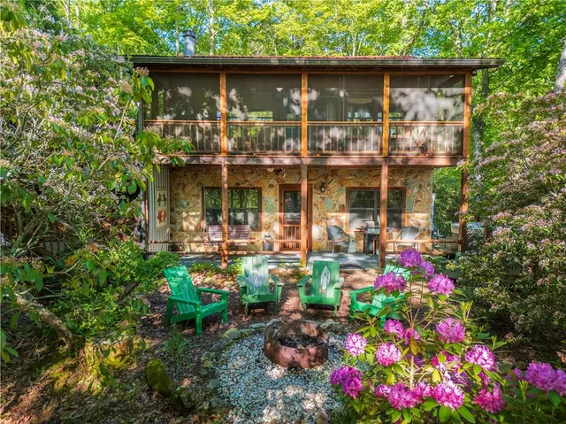 a view of a chairs in a backyard