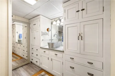 a bathroom with a glass shower door and mirror