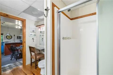 a view of a dining room and hall with furniture