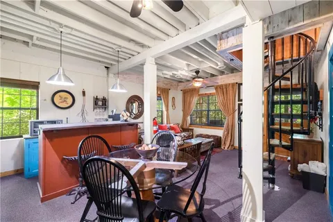 a living room with lots of furniture and a clock