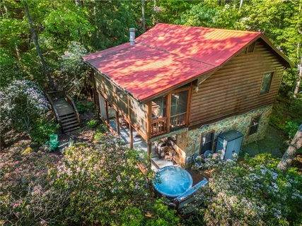 a view of a backyard with chair and table