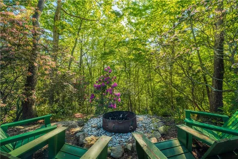 a view of balcony with wooden floor and outdoor seating