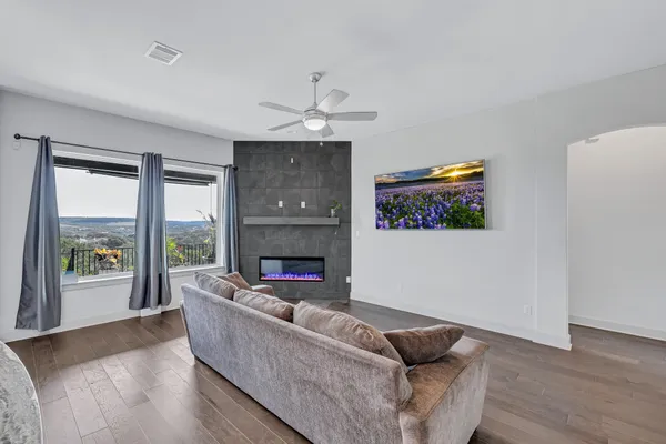 a living room with furniture and a fireplace