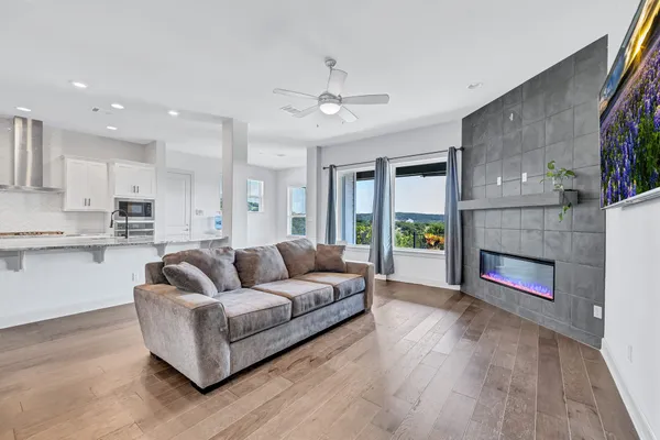 a living room with furniture and a fireplace