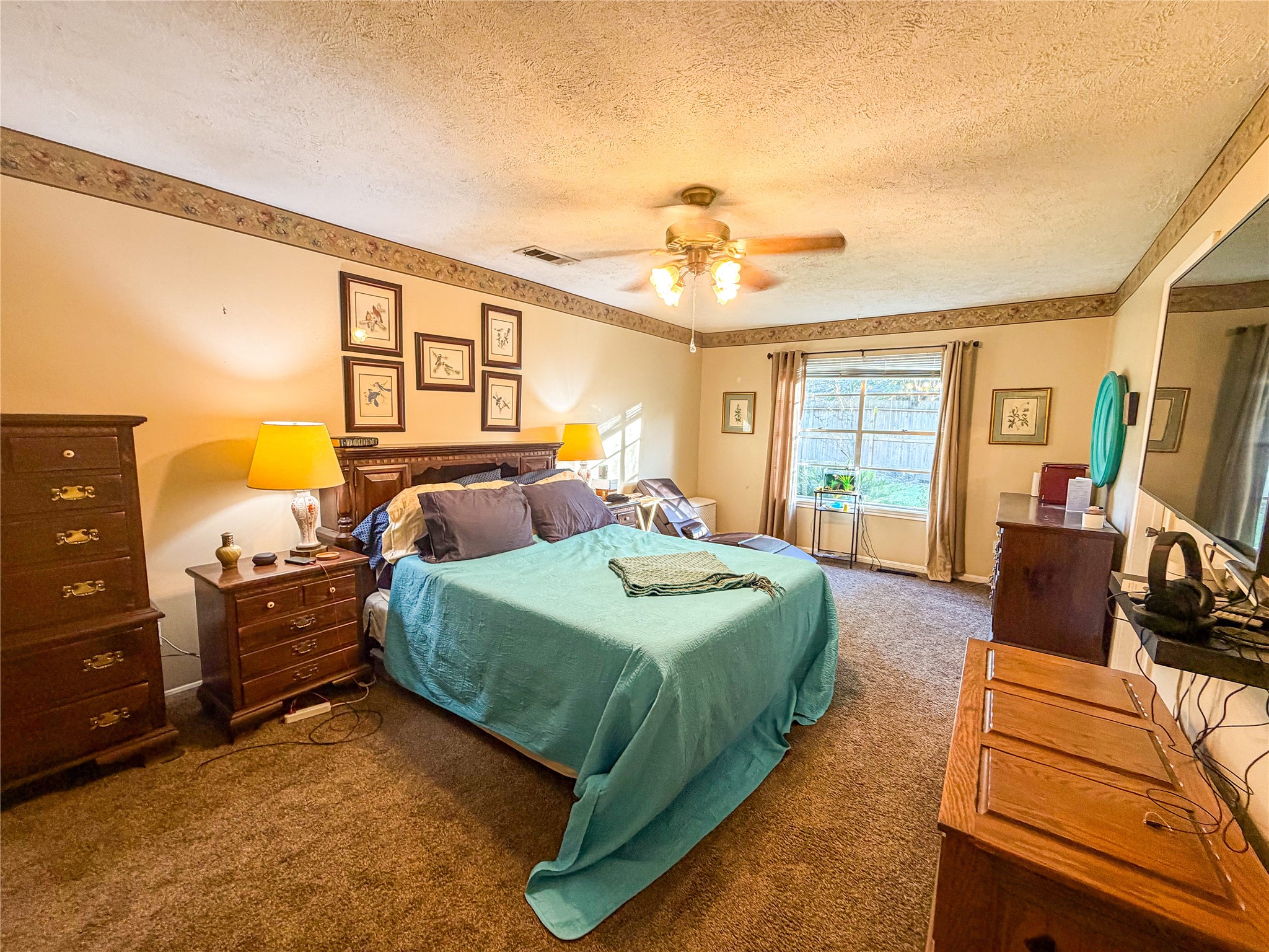 4023 Oxhill Road Spring, TX 77388 - Photo 15 of 18 a bedroom with a bed and wooden floor