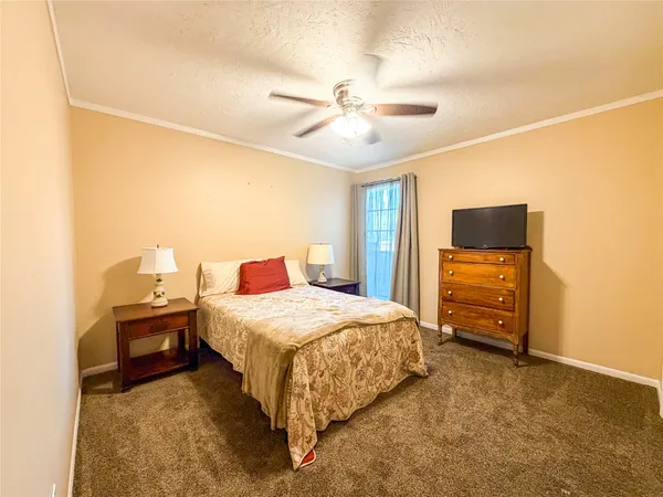 a bedroom with a bed and furniture