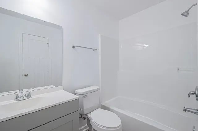 a bathroom with a sink toilet and bathtub