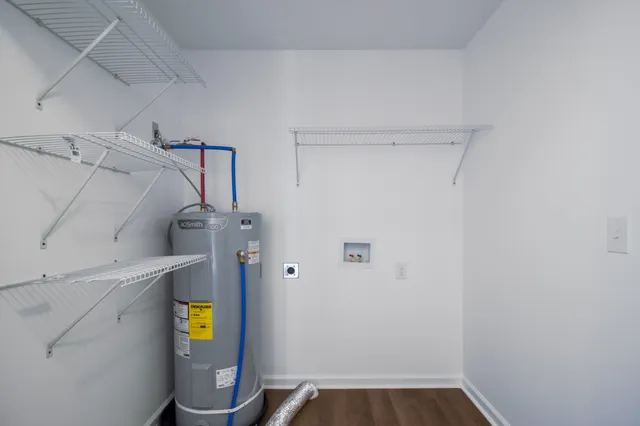 a view of storage and utility room with a window