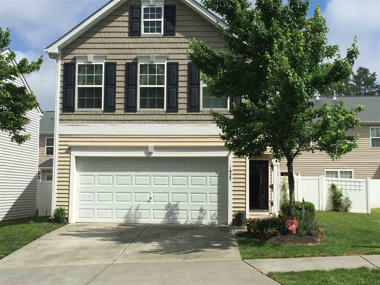 1925 Raj Drive Durham, NC 27703 - Photo 1 of 25 Beautifully landscaped and well-maintained front yard. Lots of extra GREEN grassy area to the right of the house. Exterior Front