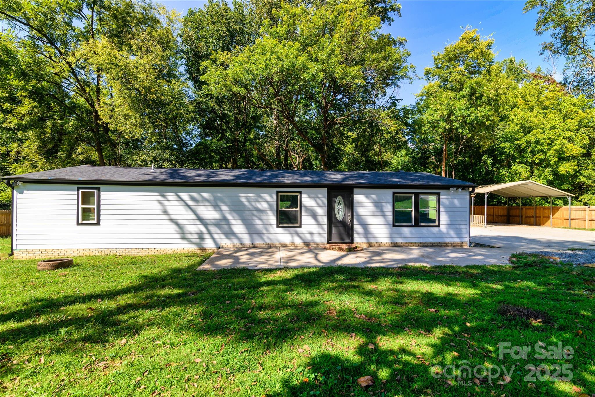 a house view with a sitting space and garden