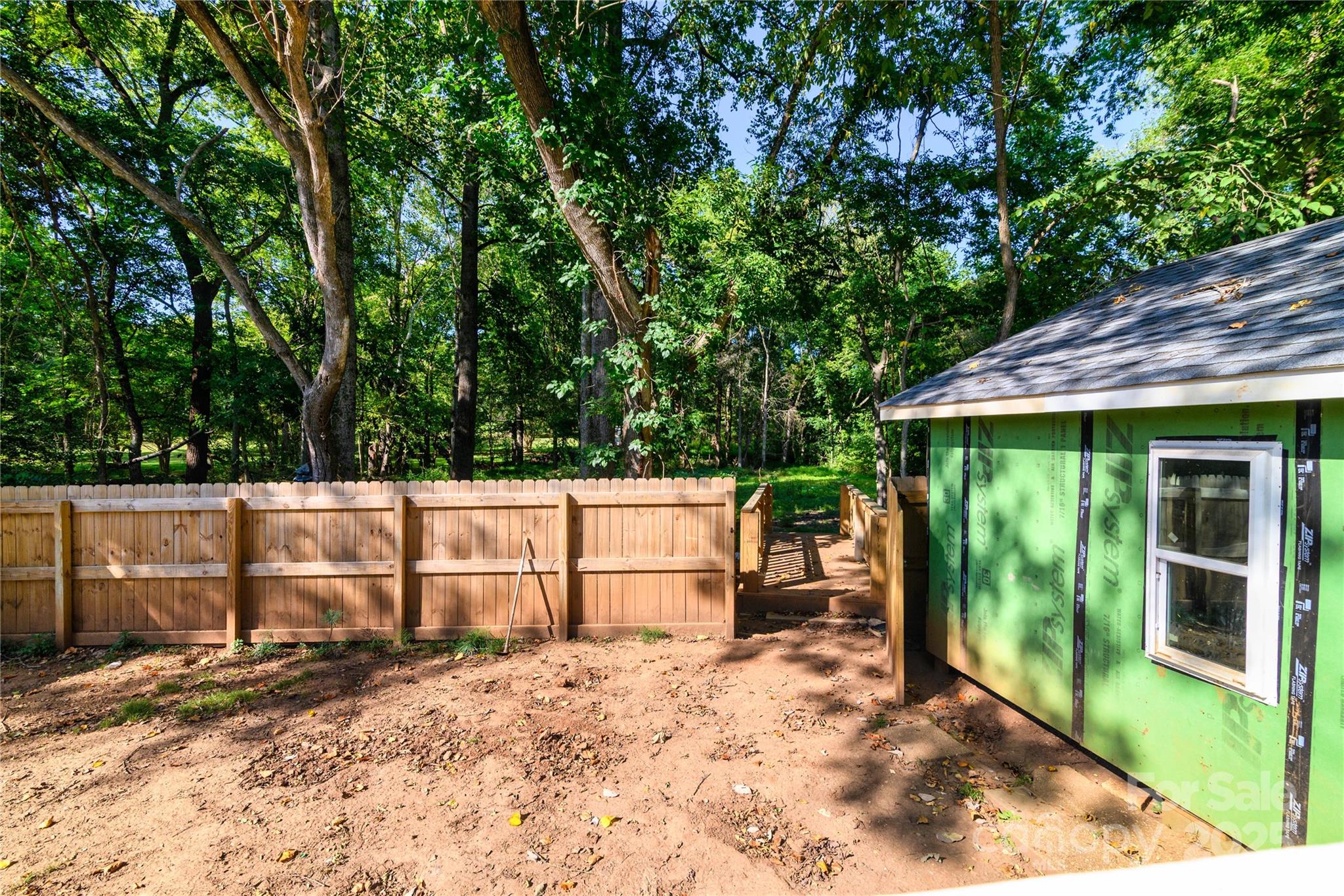 4946 Grand Canyon Road Northwest Concord, NC 28027 - Photo 12 of 40 a backyard of a house with lots of green space