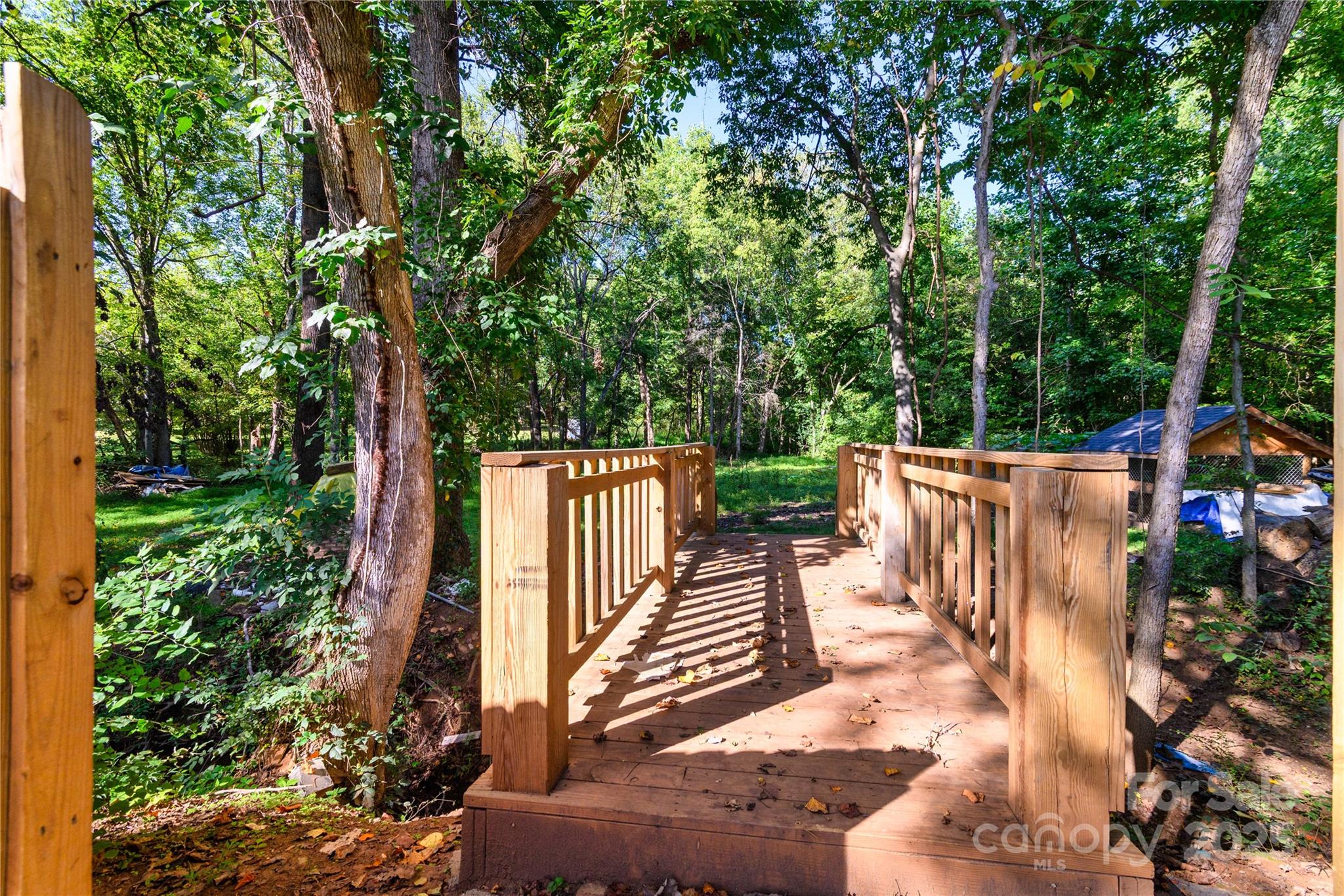 4946 Grand Canyon Road Northwest Concord, NC 28027 - Photo 13 of 40 a view of a deck with a large garden
