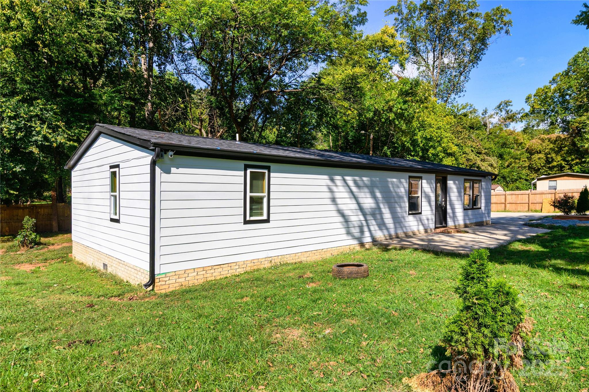 4946 Grand Canyon Road Northwest Concord, NC 28027 - Photo 2 of 40 a view of a house with backyard and sitting area