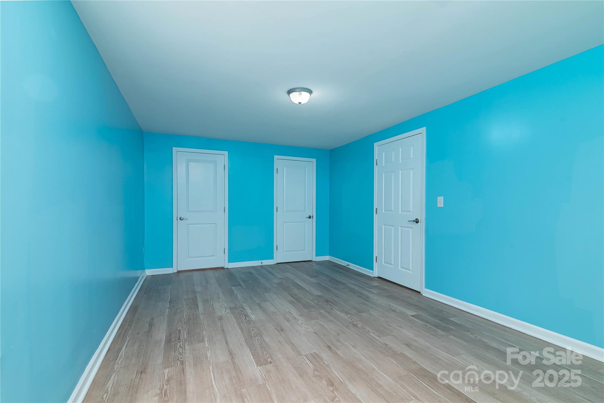 4946 Grand Canyon Road Northwest Concord, NC 28027 - Photo 30 of 40 a view of an empty room with wooden floor