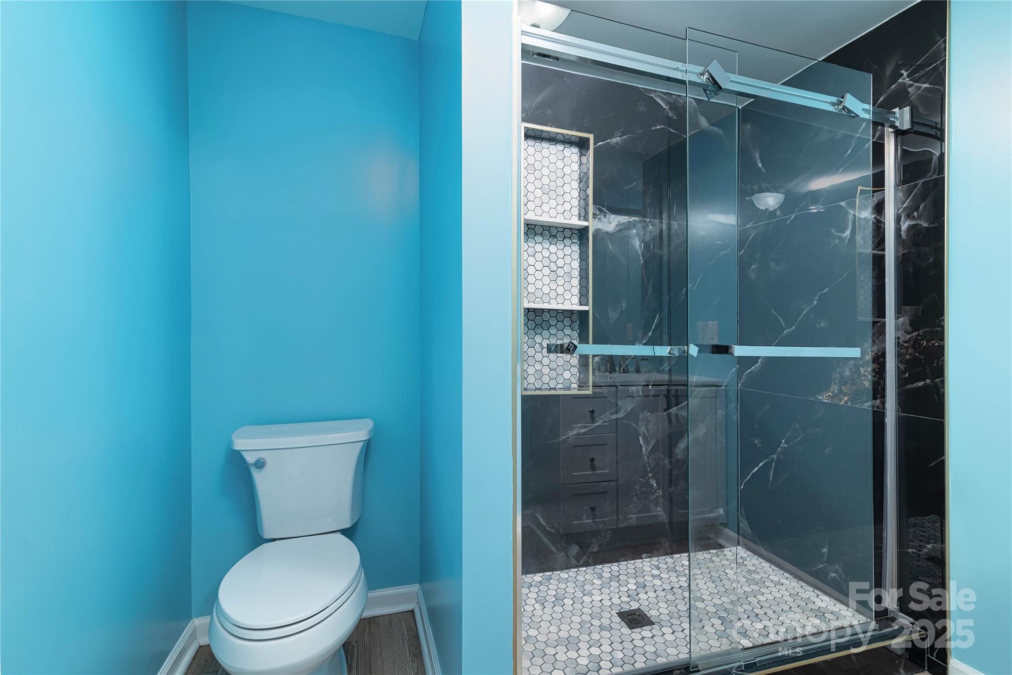 4946 Grand Canyon Road Northwest Concord, NC 28027 - Photo 34 of 40 a bathroom with a shower and toilet