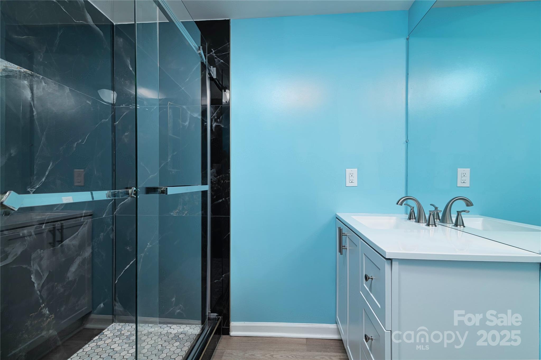 4946 Grand Canyon Road Northwest Concord, NC 28027 - Photo 35 of 40 a bathroom with a sink and mirror