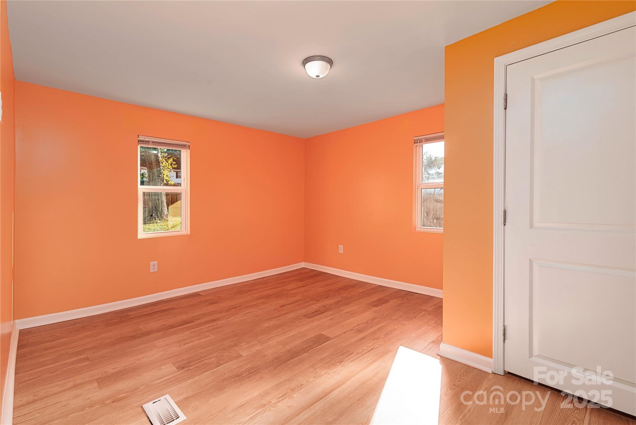 4946 Grand Canyon Road Northwest Concord, NC 28027 - Photo 36 of 40 a view of empty room with wooden floor